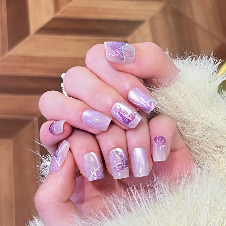 Artfully designed nail extensions with elegant flower motifs Stornfield