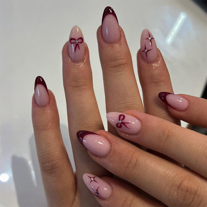 Creative artificial nail set with elegant bow and gradient design Stornfield
