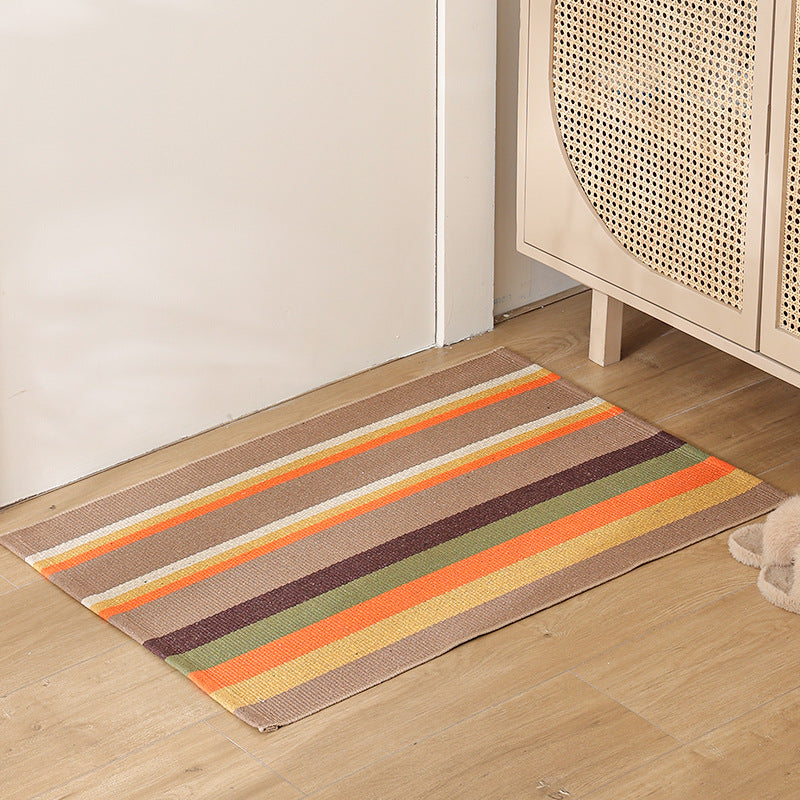 Striped cotton doormat with non-slip bottom and decorative woven edge Stornfield