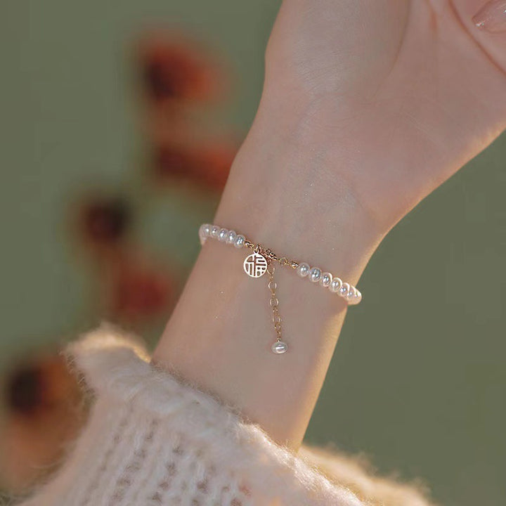 Elegant Pearl Charm Bracelet Stornfield