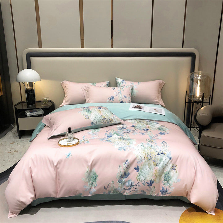 Cotton satin bedding set with watercolor flower print and reversible blanket