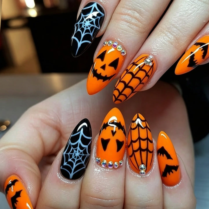 Acrylic nail set with Halloween designs and glitter elements Stornfield