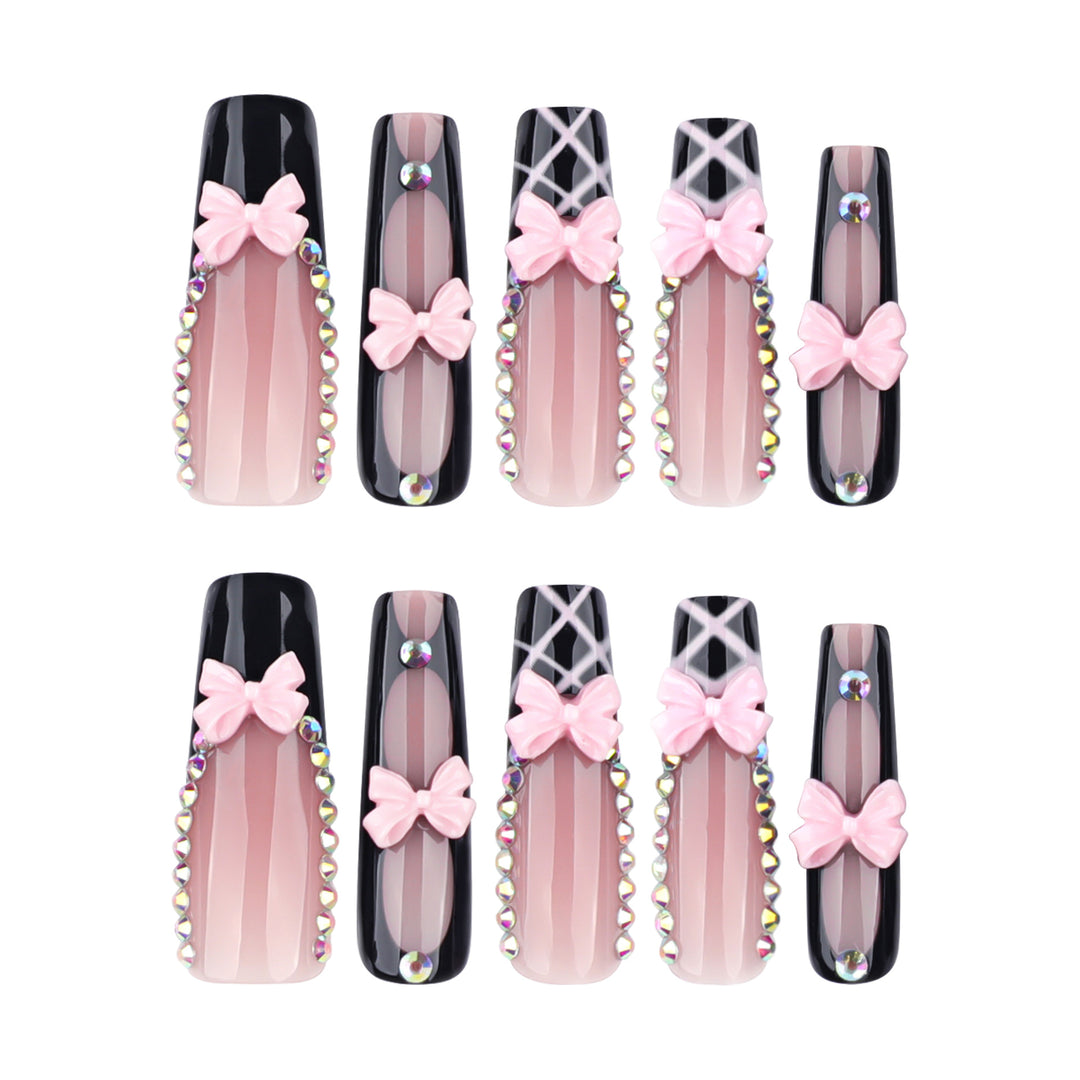 Artistic acrylic nails with floral design and rhinestone bow Stornfield