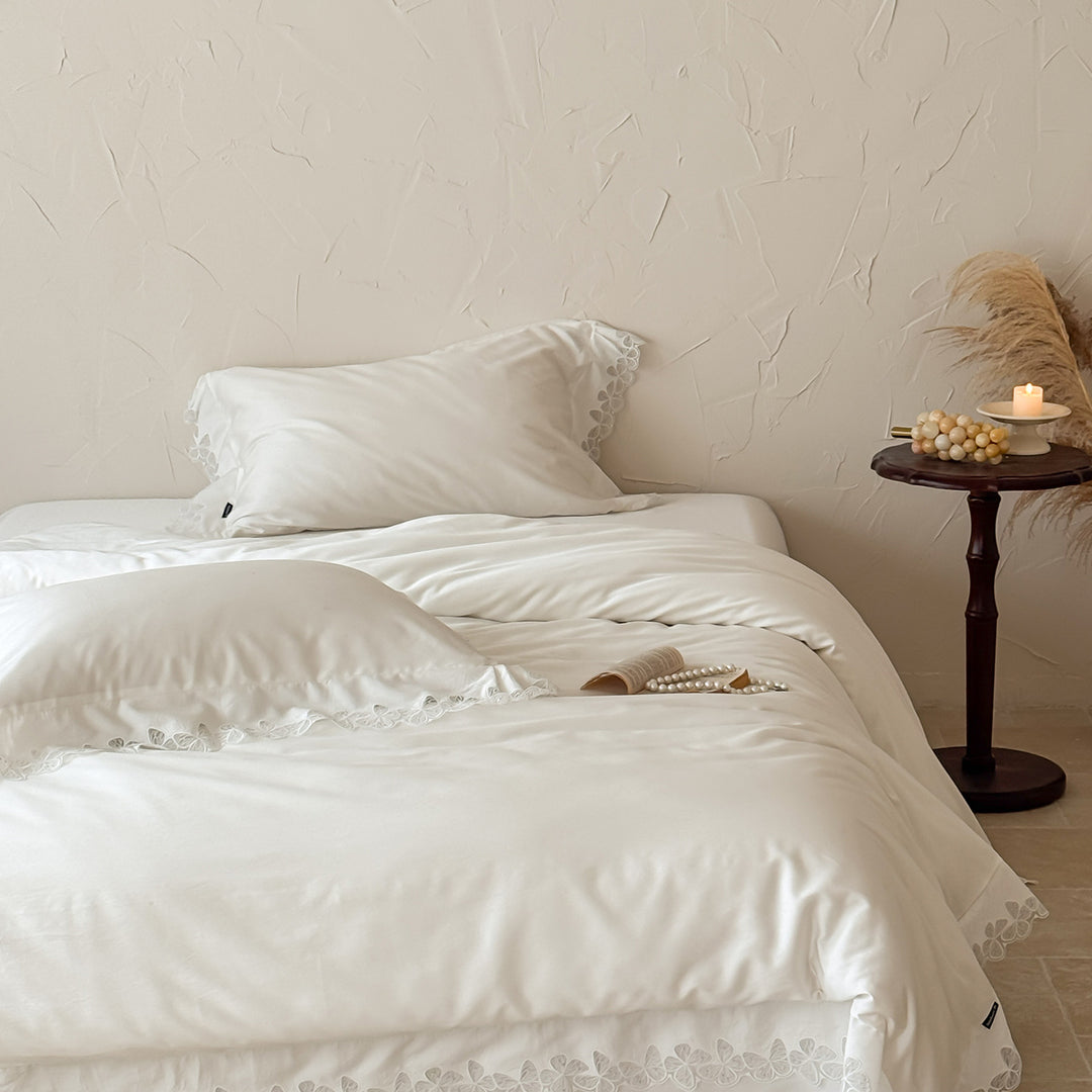 Satin bedding set with silky-smooth texture and floral lace trim