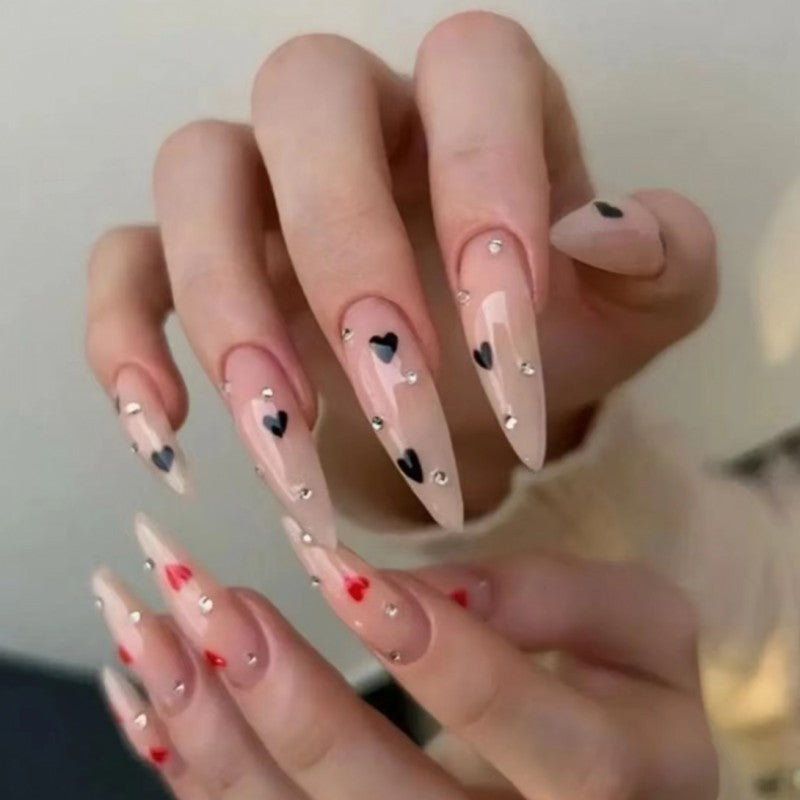 Glamorous artificial nails with heart accents Stornfield