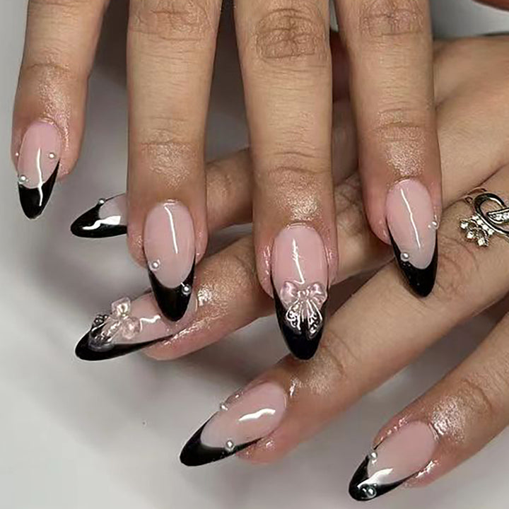 Artificial nail set with glossy French design and delicate 3D accents Stornfield