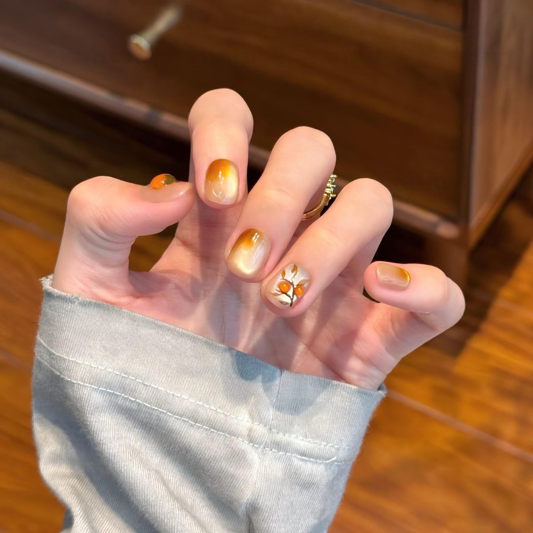 Artificial nails in elegant ombre look with floral accent Stornfield