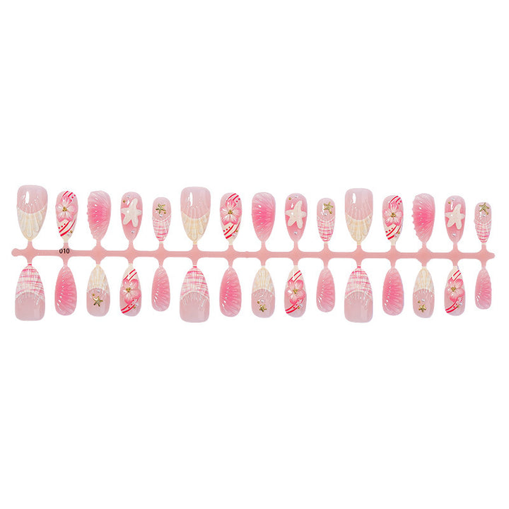 Artificial nail set with maritime shell and flower design Stornfield