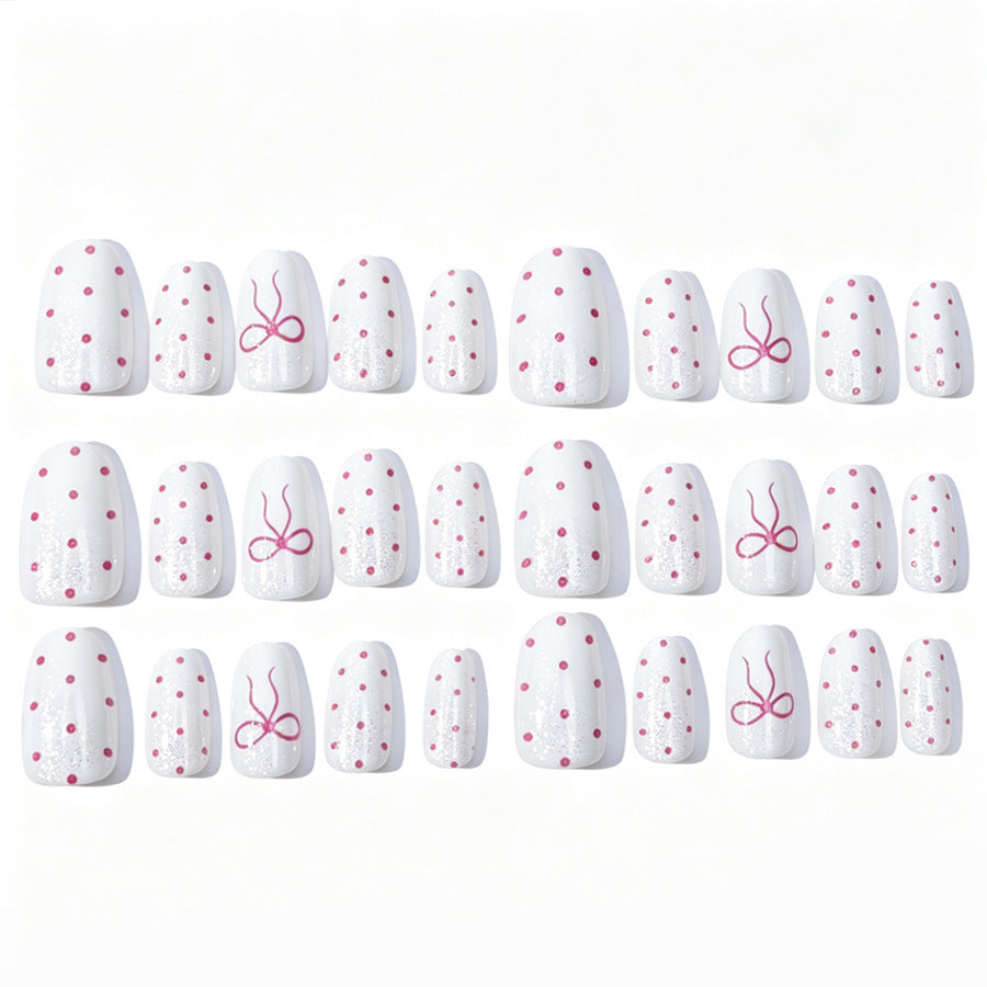 Artificial nail set with delicate dots and bow pattern Stornfield