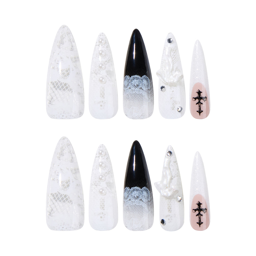 Artful stiletto nails with unique 3D elements and glitter accents Stornfield