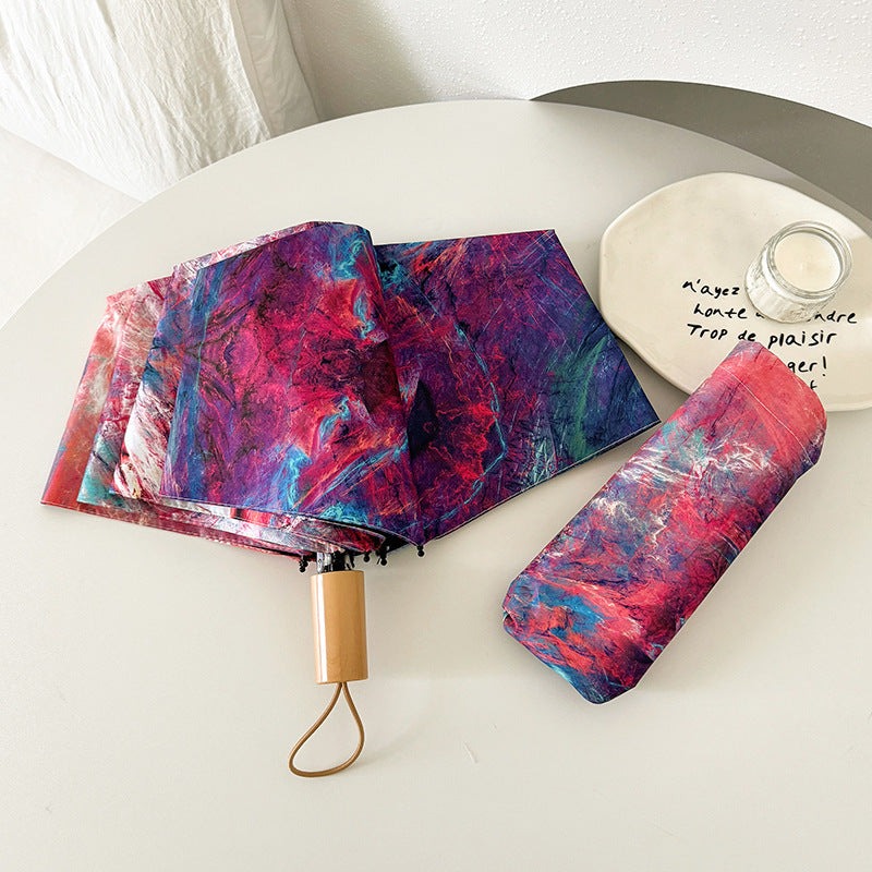 Ladies elegant folding umbrella with unique marble pattern Stornfield