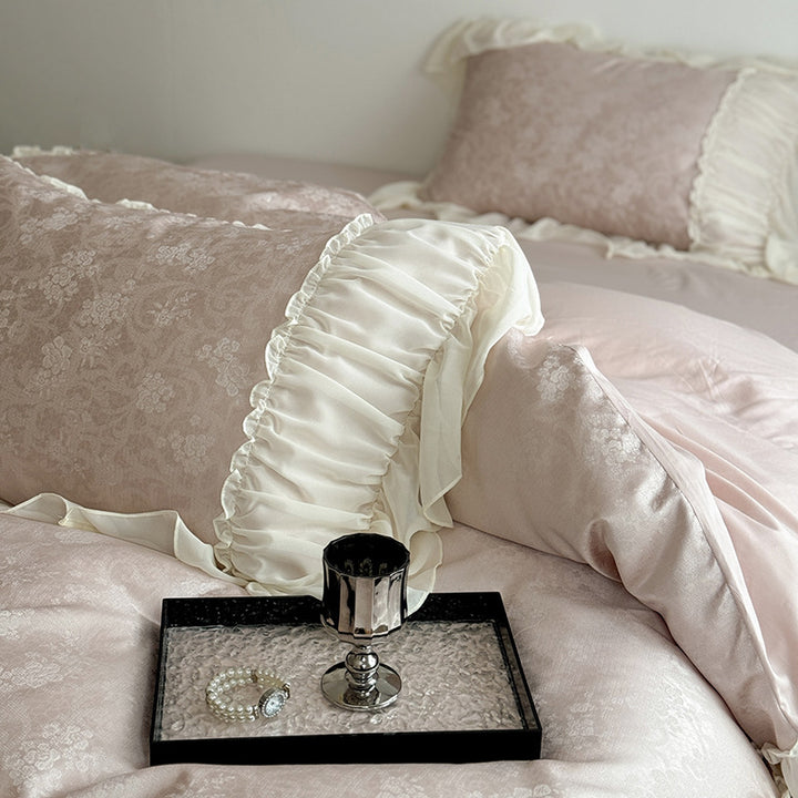 Satin bedding set with ruffled border and fine damask relief