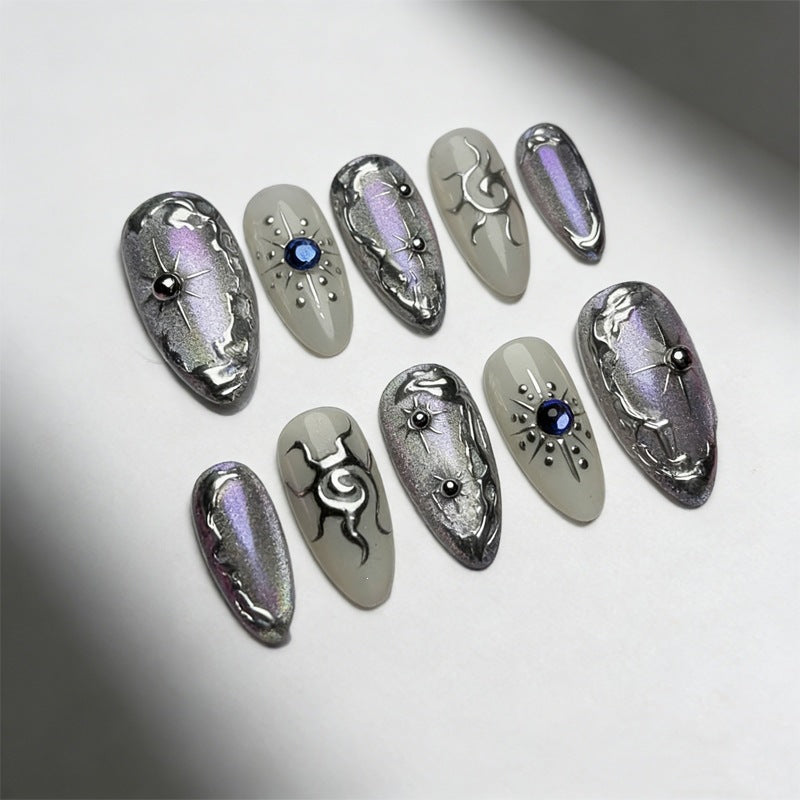 Artificial nail set with shiny metallic effect and elegant decorations Stornfield