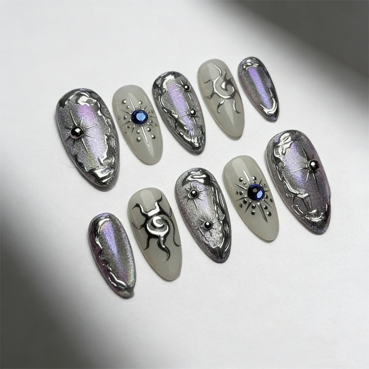 Artificial nail set with shiny metallic effect and elegant decorations Stornfield