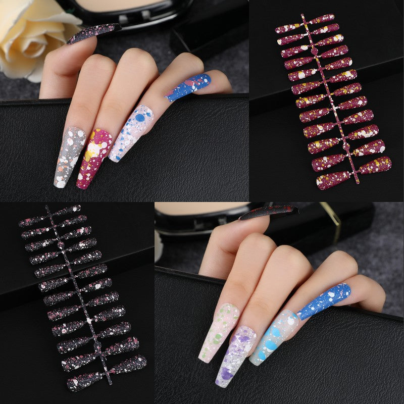 Artistic splatter design artificial nails Stornfield