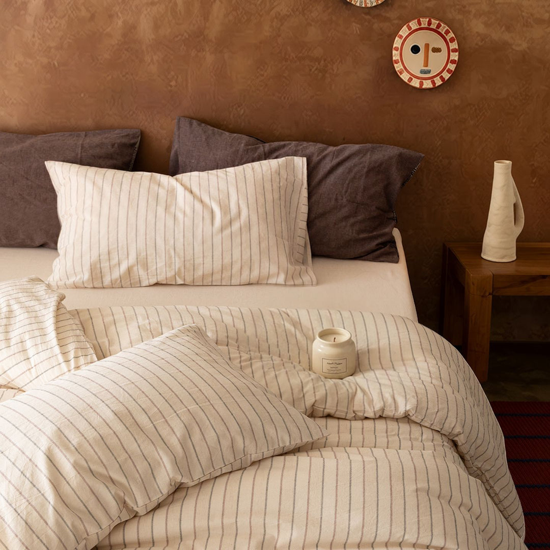 Linen bedding set with fine pinstripes and reversible function