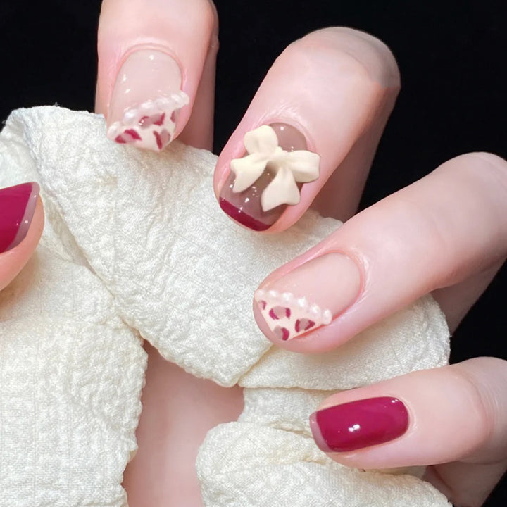 Artful nail art with elegant bow design Stornfield
