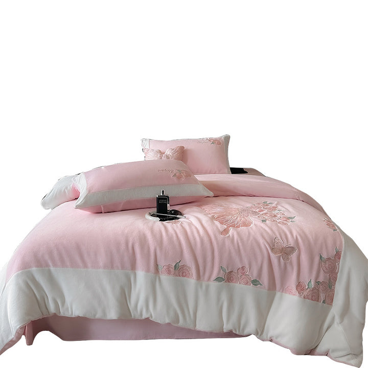 Luxurious quilted bedding set made of microfiber with floral relief and reversible design