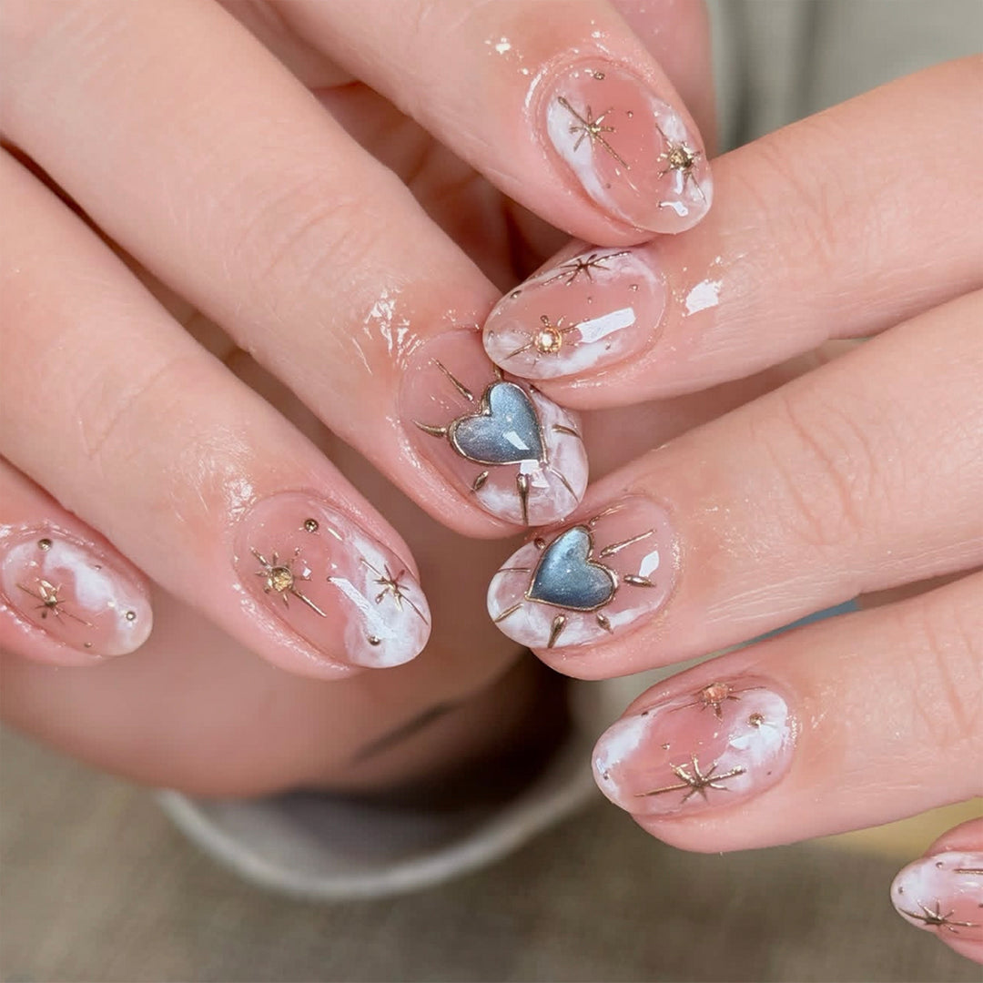 Nail design with decorative hearts and glitter accents Stornfield