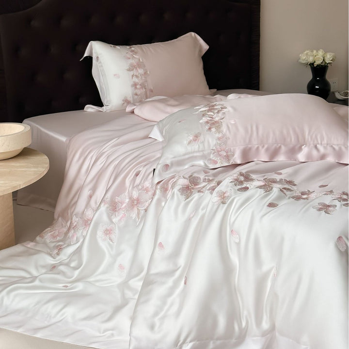 Luxurious satin bedding set with floral embroidery border and silky shine surface