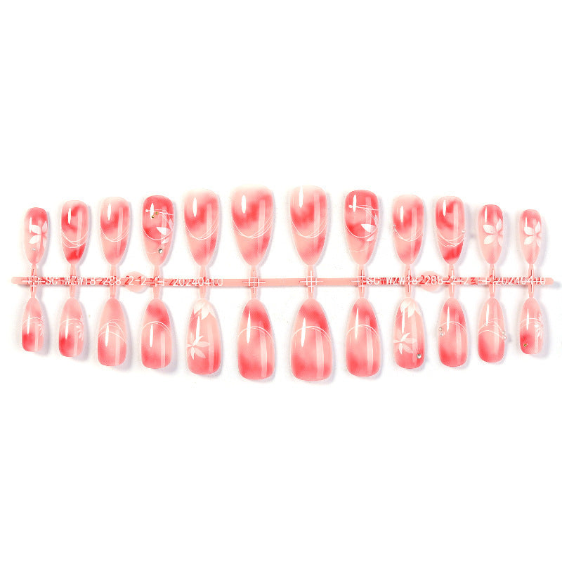 Acrylic nail set with elegant ombre design and floral accent Stornfield