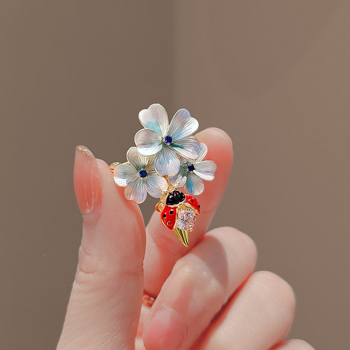 Flower brooch with ladybug and crystal Stornfield