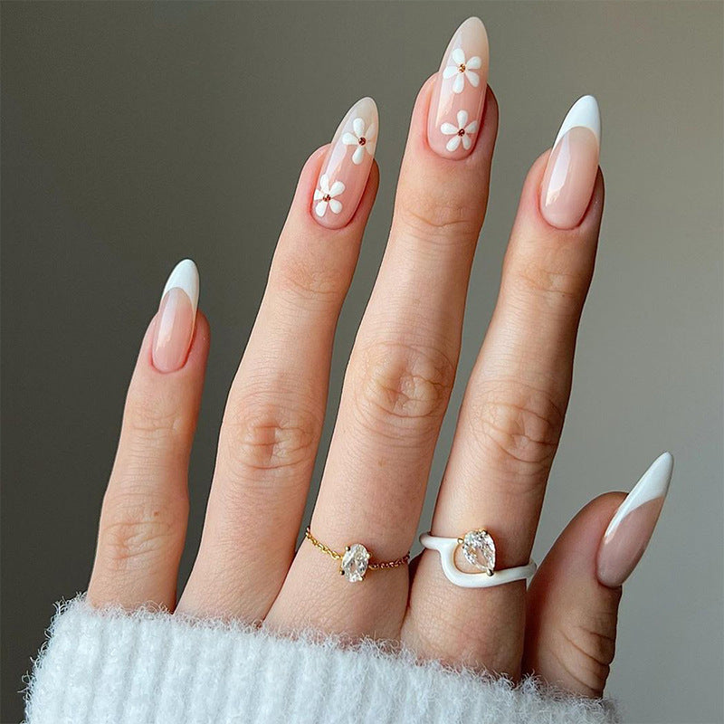 Artful stiletto nails with floral accents Stornfield