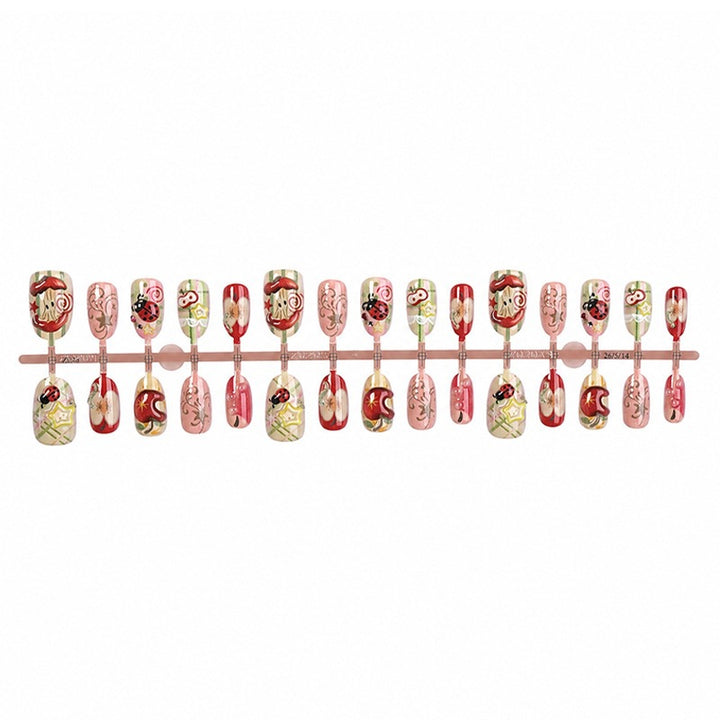 Creative nail art set with playful designs and glitter accents Stornfield