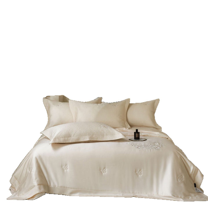 Luxurious cotton satin bedding set with quilted bedspread and floral embroidery