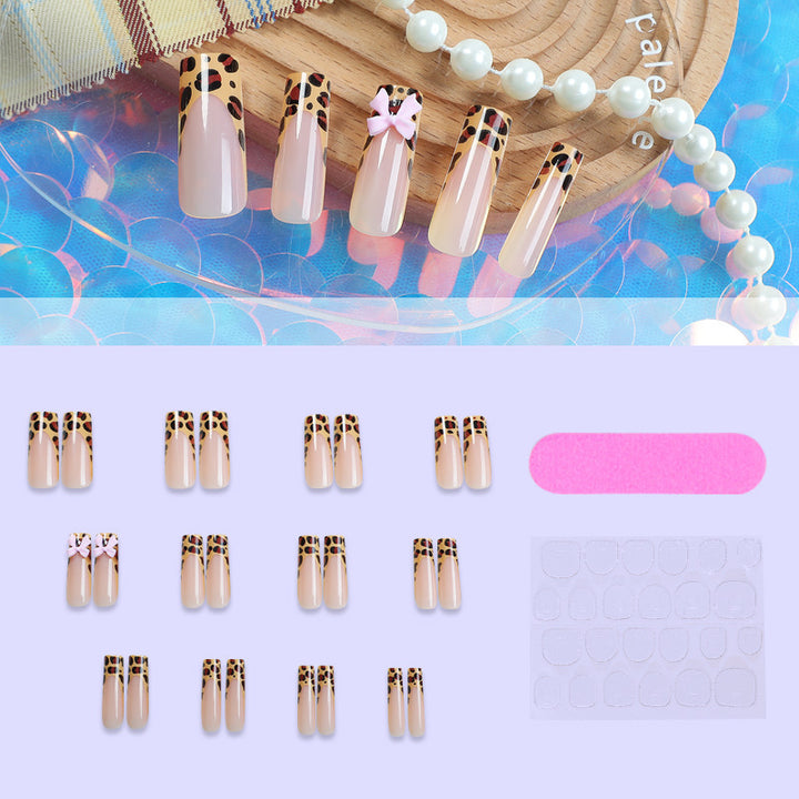 Decorative Stiletto Press-On Nail Art with Animal Print and Bow Accents Stornfield