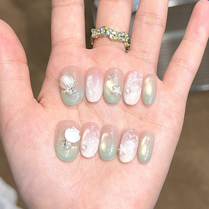Artificial nail tips with maritime design and glitter effects Stornfield
