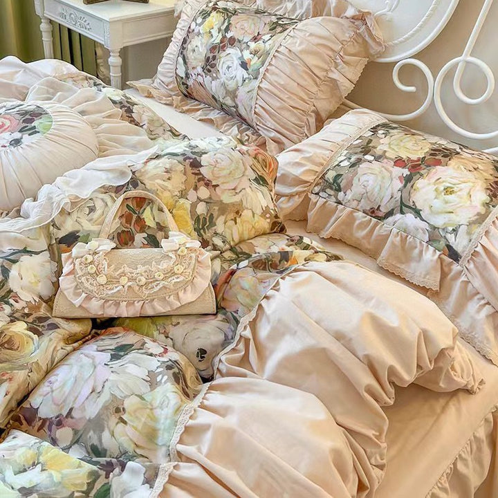 Romantic bedding set with ruffles, quilted bedspread and decorative cushion