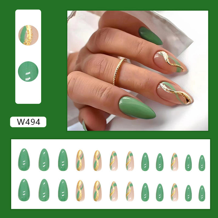 Glamorous artificial nails with elegant gold accents