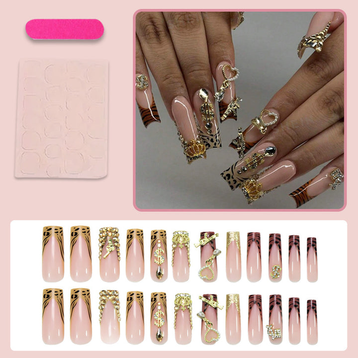 Artificial nail set with elegant golden and animal decorations Stornfield