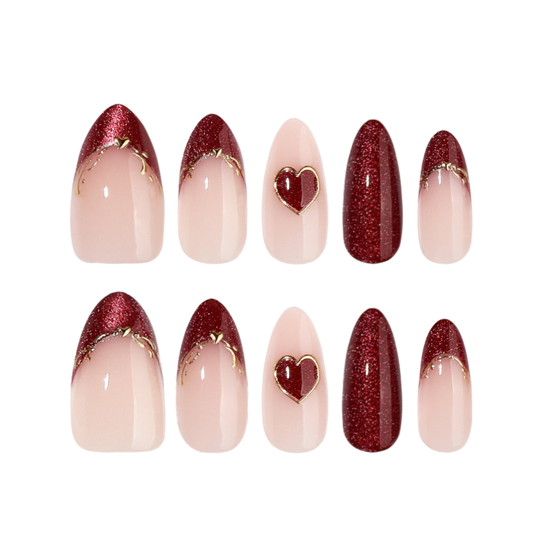 Artful stiletto nails with heart designs and glitter embellishment Stornfield