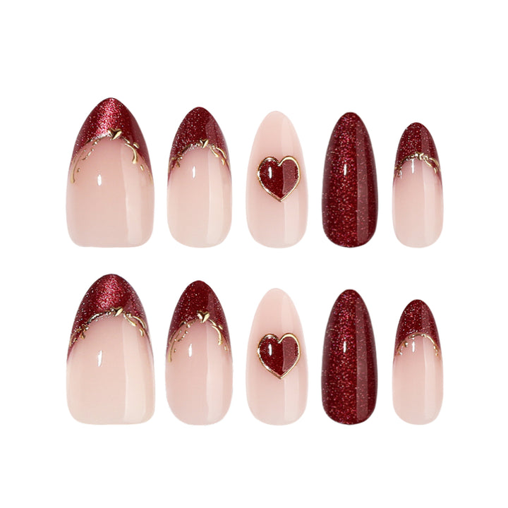 Artful stiletto nails with heart designs and glitter embellishment Stornfield