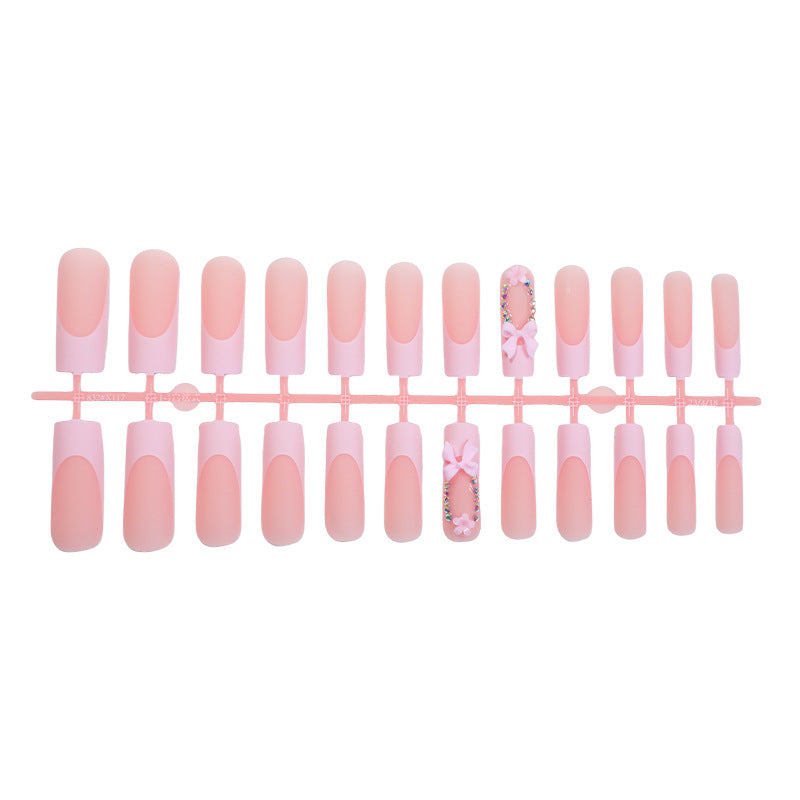 Decorative Press-On Nail Art with Floral and Bow Accents Stornfield