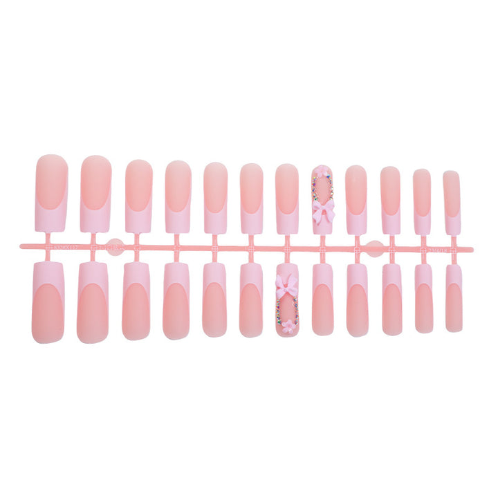 Decorative Press-On Nail Art with Floral and Bow Accents Stornfield