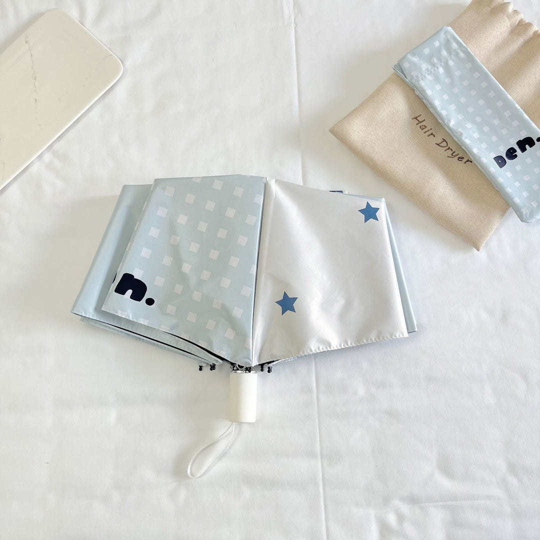 Women's folding umbrella with unique star pattern and practical carrying bag Stornfield