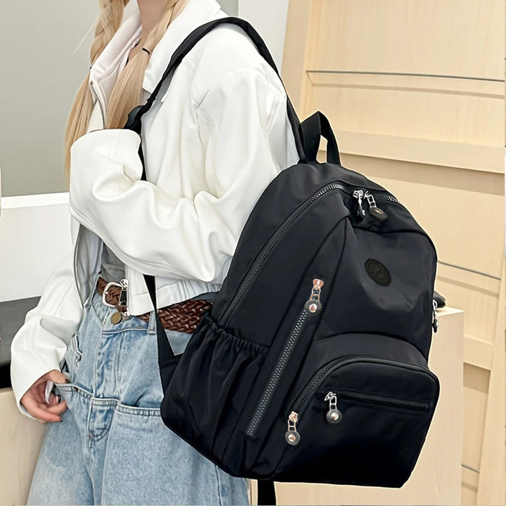 Multi-Pocket Travel Backpack with Water-Resistant Material Stornfield