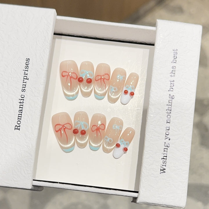 Artificial nail tips with romantic bow and cherry motifs Stornfield