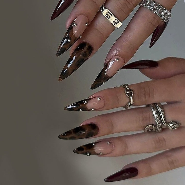 Art nail set with elegant, creative designs and sparkling accents Stornfield
