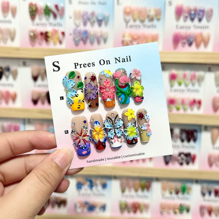 Artistic Press-On Nail Art Set with Vibrant Flower and Butterfly Designs