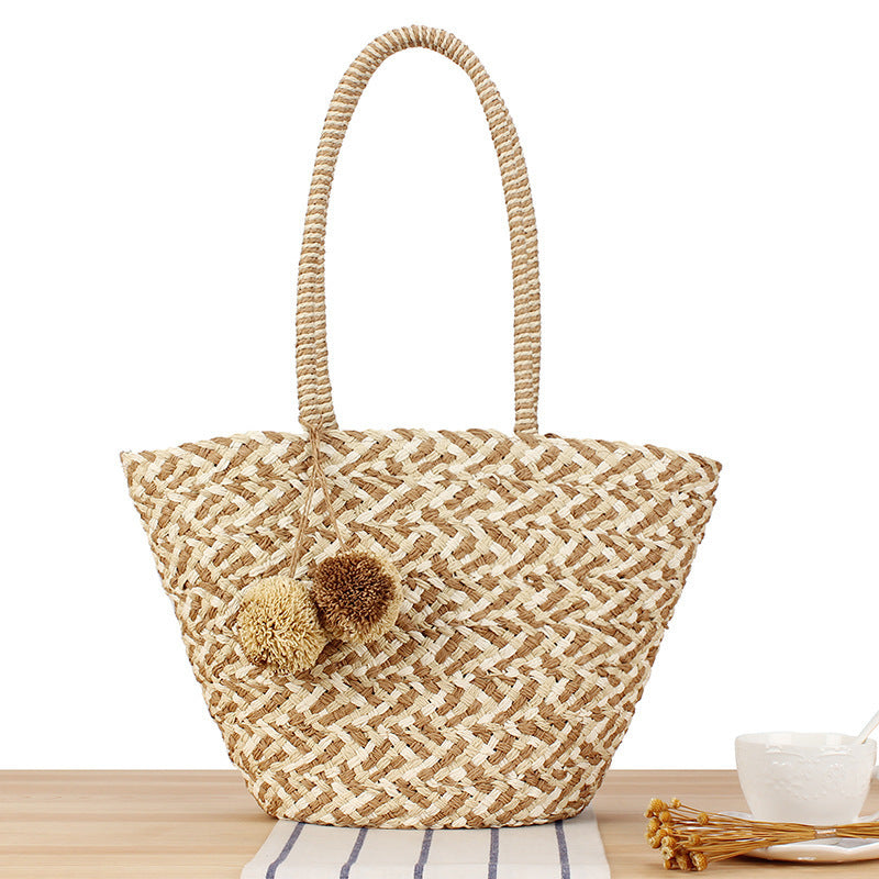 Summer wicker handbag with pom poms Stornfield