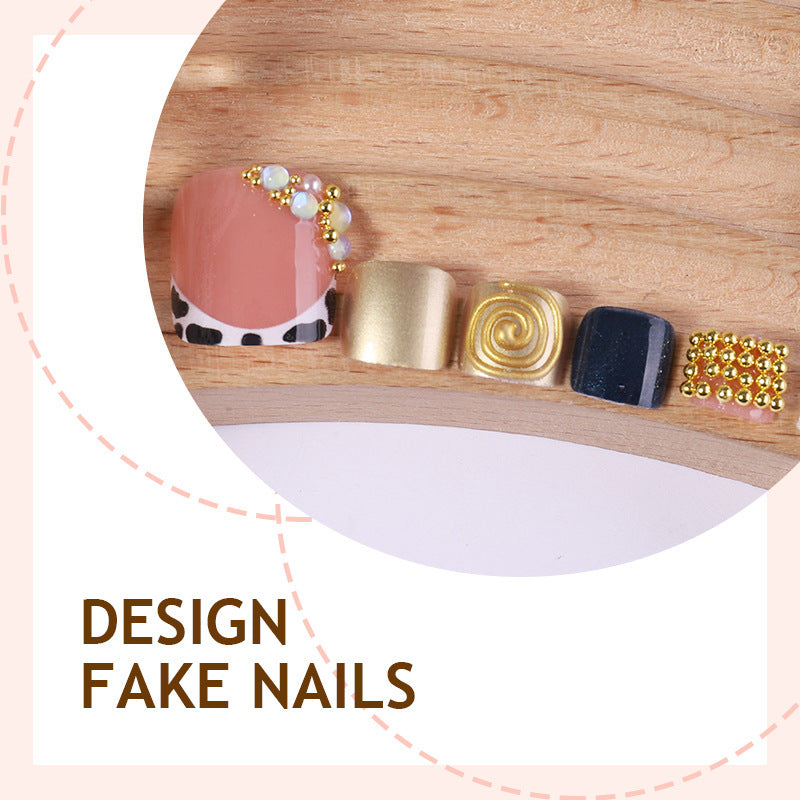 Acrylic nail set with luxurious golden embellishments Stornfield