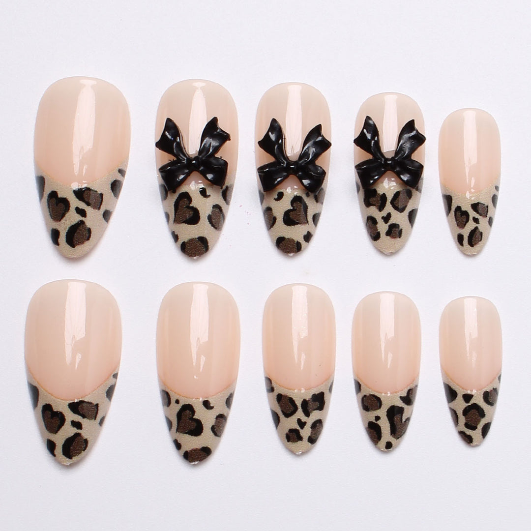 Creative artificial nails with stylish leopard pattern and bow accents Stornfield