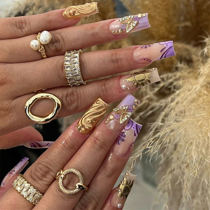 Artificial nail set with delicate flower and glitter accents Stornfield