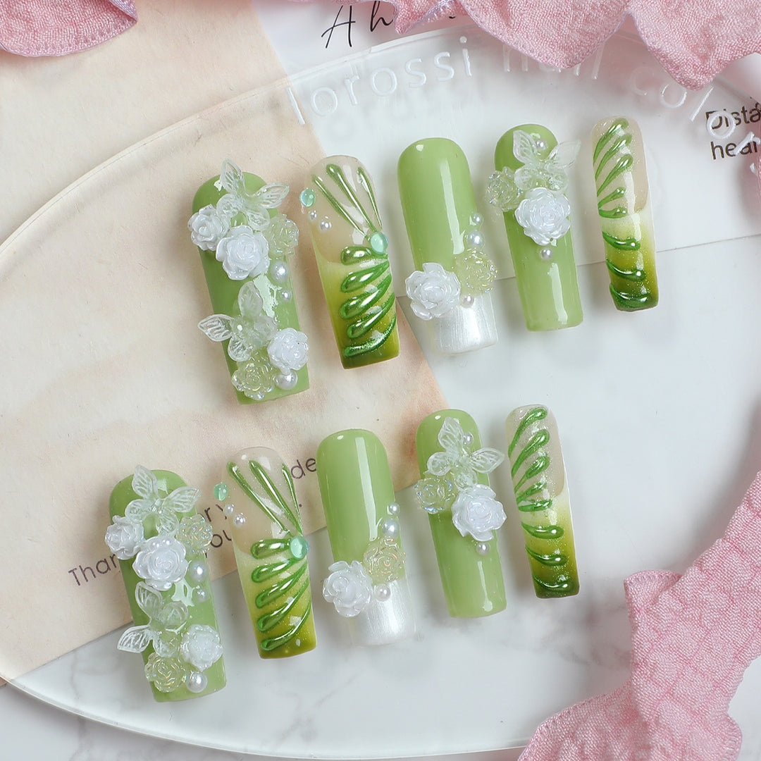 Creative nail set with floral design and delicate accents Stornfield