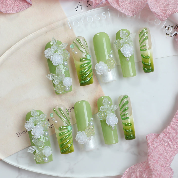 Creative nail set with floral design and delicate accents Stornfield