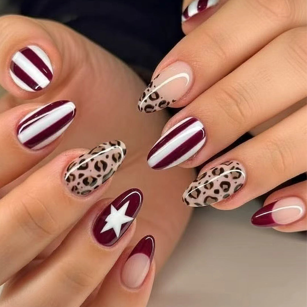 Artful stiletto nails with leopard pattern and elegant glitter decoration Stornfield
